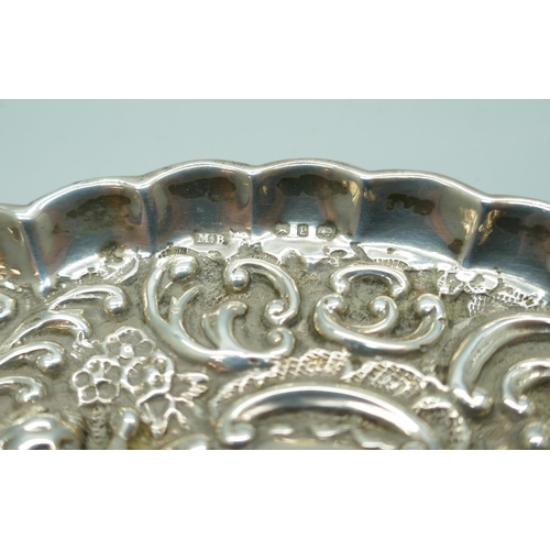 7241 - A Victorian silver embossed tray, Birmingham 1898, 35g, (a/f, one small hole), 11.8cm