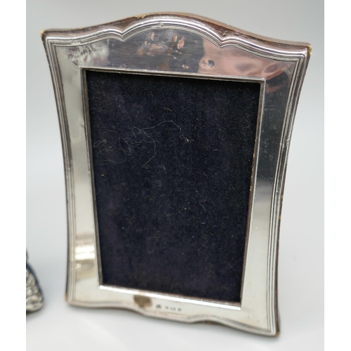 7244 - Two small silver photograph frames, tallest 10.7cm, and a silver pill box