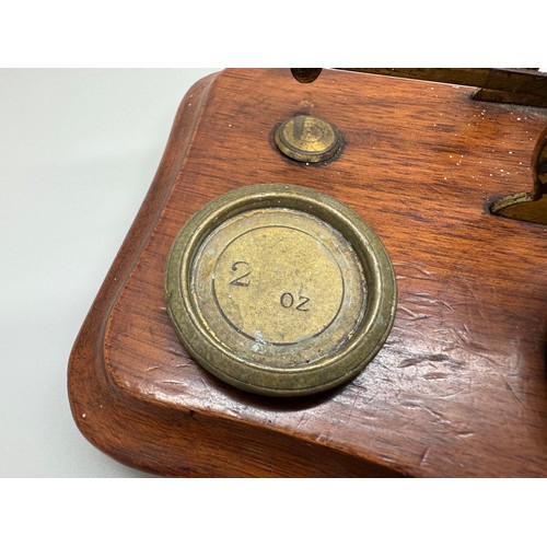 2024 - A set of Windle & Blyth Victorian postal weighing scales on a mahogany base, with brass weights