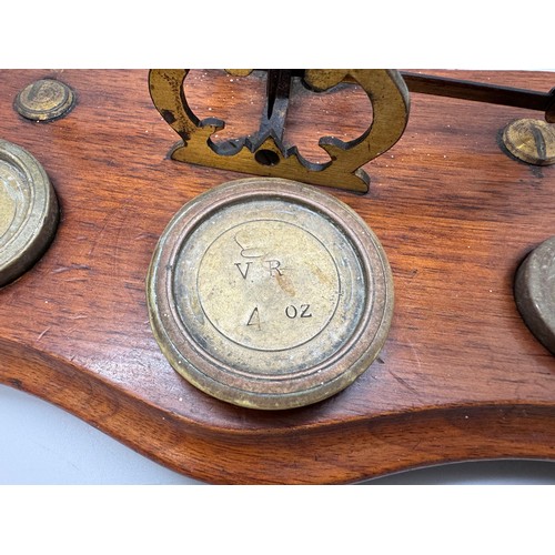 2024 - A set of Windle & Blyth Victorian postal weighing scales on a mahogany base, with brass weights