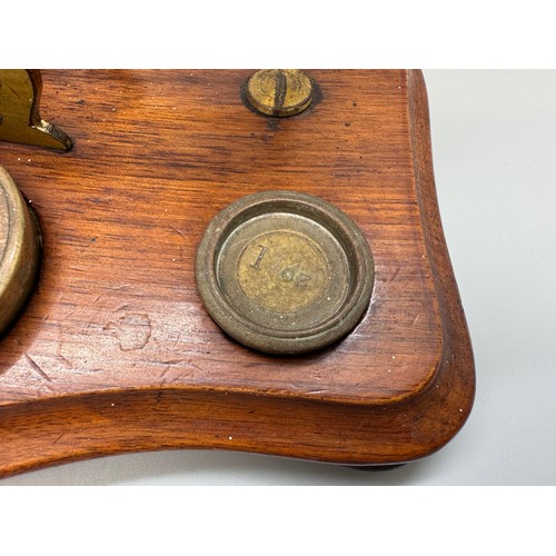 2024 - A set of Windle & Blyth Victorian postal weighing scales on a mahogany base, with brass weights