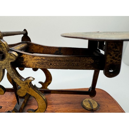 2024 - A set of Windle & Blyth Victorian postal weighing scales on a mahogany base, with brass weights