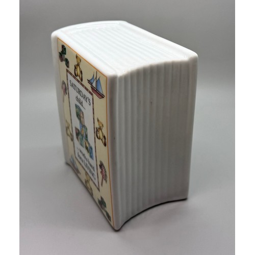 2088 - A Royal Worcester Saturday's Child money box in the form of a book, Days Of The Week, 2004, designed... 