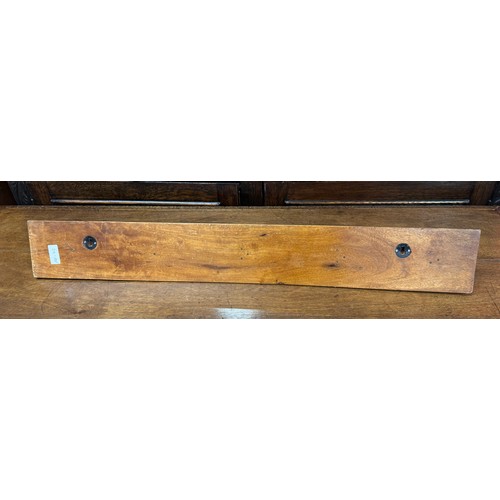 2179 - A set of beech mounted hand painted coat hooks, 77cm