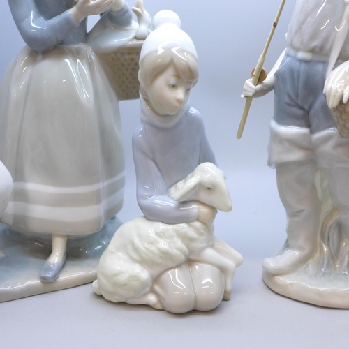 2001 - Four Lladro figures, including Young Fisherman, H-16 E, Girl with ducks and umbrella, another girl w... 