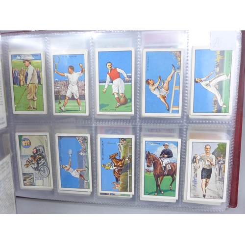 2037 - Cigarette cards; an album of nine sets of cigarette cards including Player's 'Cricketers-1930, 1934 ... 