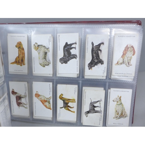 2037 - Cigarette cards; an album of nine sets of cigarette cards including Player's 'Cricketers-1930, 1934 ... 