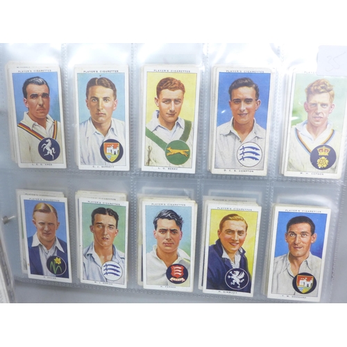 2037 - Cigarette cards; an album of nine sets of cigarette cards including Player's 'Cricketers-1930, 1934 ... 