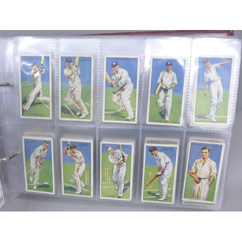 2037 - Cigarette cards; an album of nine sets of cigarette cards including Player's 'Cricketers-1930, 1934 ... 