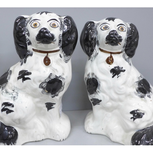 2040 - A pair of Staffordshire spaniels and a Beswick spaniel