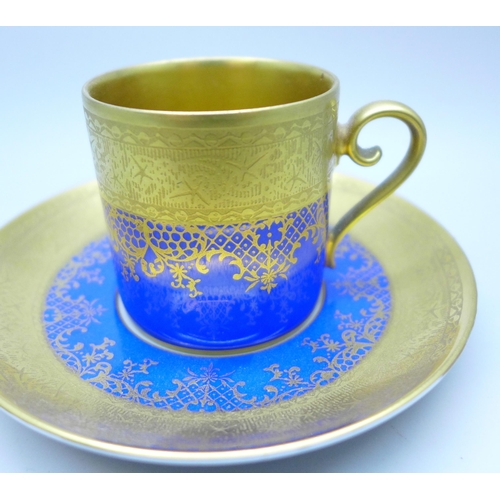 2045 - A German porcelain, gilded coffee cup and saucer, circa 1930