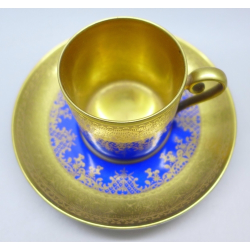 2045 - A German porcelain, gilded coffee cup and saucer, circa 1930