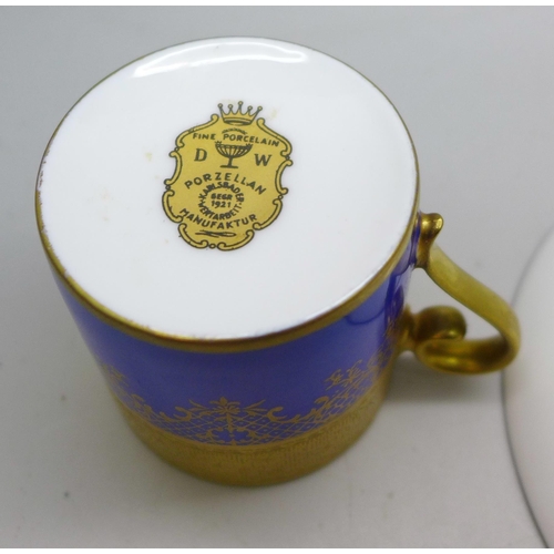 2045 - A German porcelain, gilded coffee cup and saucer, circa 1930