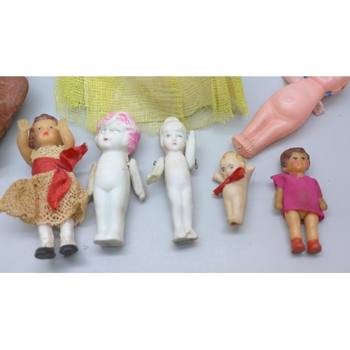 2049 - Thirteen small dolls, bisque including three marked made in Japan, celluloid and rubber