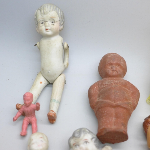 2049 - Thirteen small dolls, bisque including three marked made in Japan, celluloid and rubber