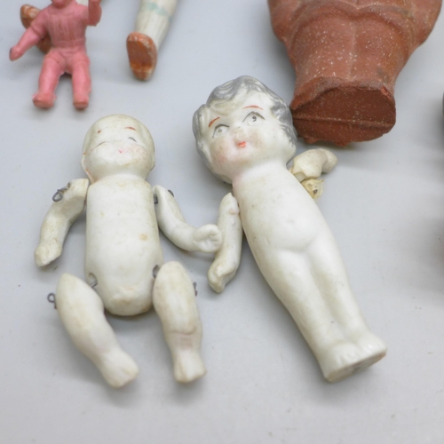 2049 - Thirteen small dolls, bisque including three marked made in Japan, celluloid and rubber