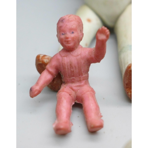 2049 - Thirteen small dolls, bisque including three marked made in Japan, celluloid and rubber