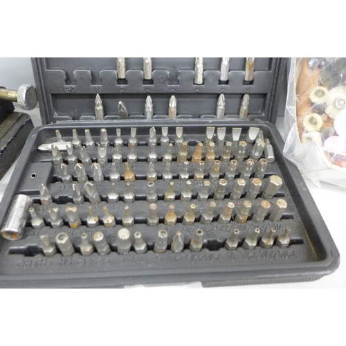 2080 - A collection of watch makers tools includes a professional case opener, a watchmakers blacking lamp,... 