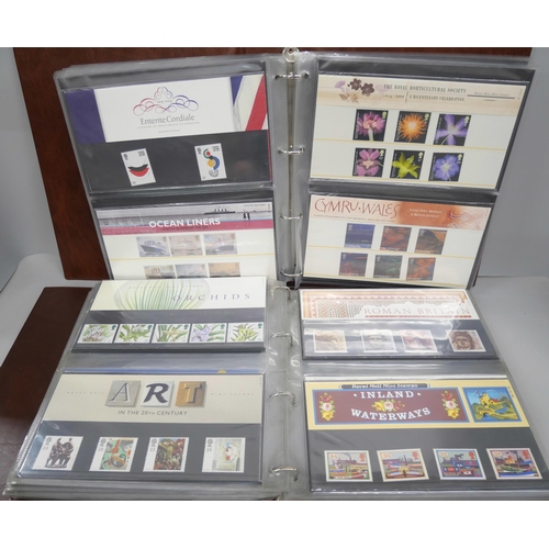 2106 - Stamps; a collection of approximately 235 Royal Mail Mint stamps in four albums, some duplicates