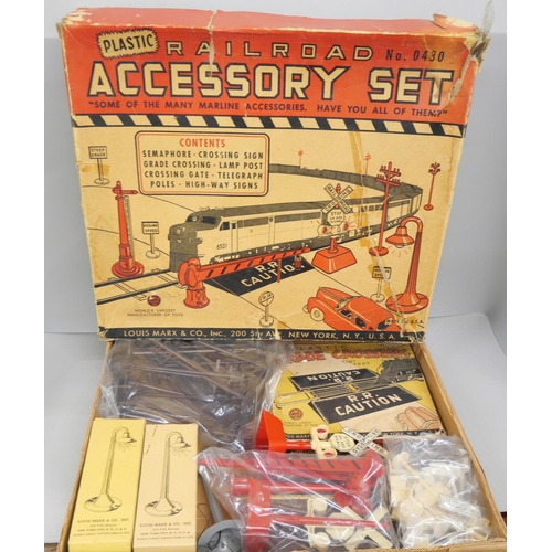 2143 - A large collection of Louis Marx tin-plate model railway and a Marx plastic Railroad Accessory set *... 