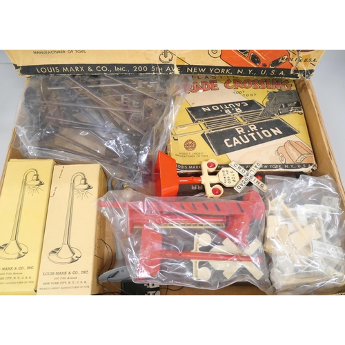 2143 - A large collection of Louis Marx tin-plate model railway and a Marx plastic Railroad Accessory set *... 