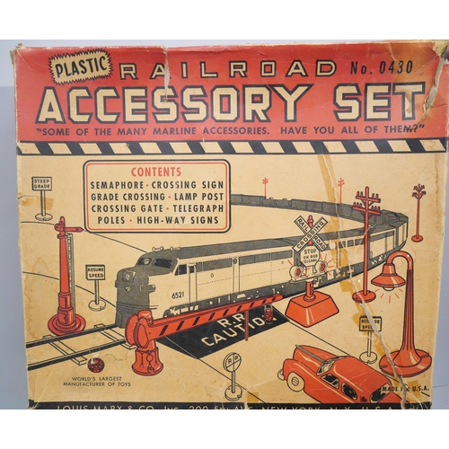 2143 - A large collection of Louis Marx tin-plate model railway and a Marx plastic Railroad Accessory set *... 