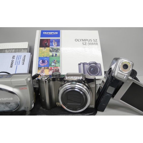 2164 - Two Olympus cameras, Olympus SZ boxed and Olympus digital camera C-300 zoom