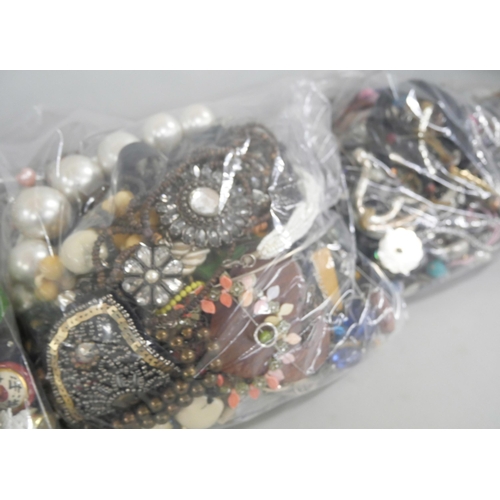 2188 - Three large bags of costume jewellery