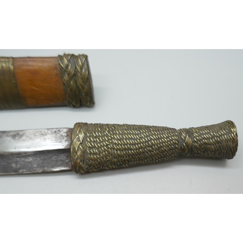 2211 - An African tribal dagger with scabbard, 20.5cm *This lot is not available for packing and posting*