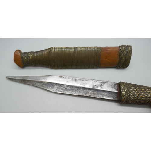 2211 - An African tribal dagger with scabbard, 20.5cm *This lot is not available for packing and posting*