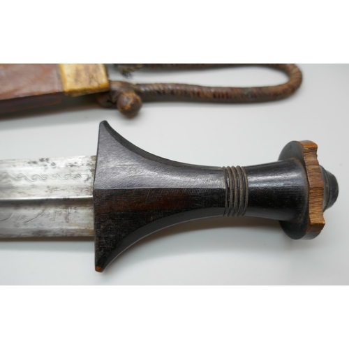 2213 - An African armlet dagger, handle chipped *This lot is not available for packing and posting