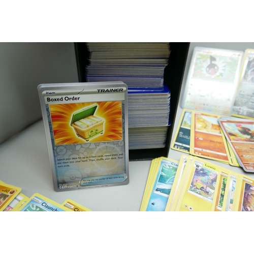 2244 - A collection of over 500 Pokemon cards with holographic, (no Energy cards), in collectors box