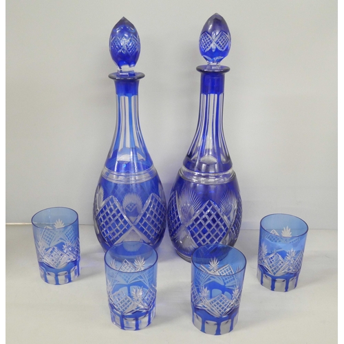 2255 - A pair of Czech Bohemian style blue and clear cut crystal decanters with four glasses **PLEASE NOTE ... 