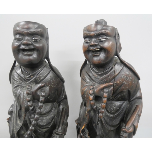 2261 - Two early 20th Century carved Laughing Buddha figures, 34cm