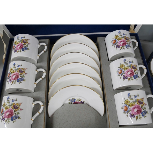 2266 - A collection of Royal Worcester bone china includes a boxed coffee set and a set with two trinket tr... 