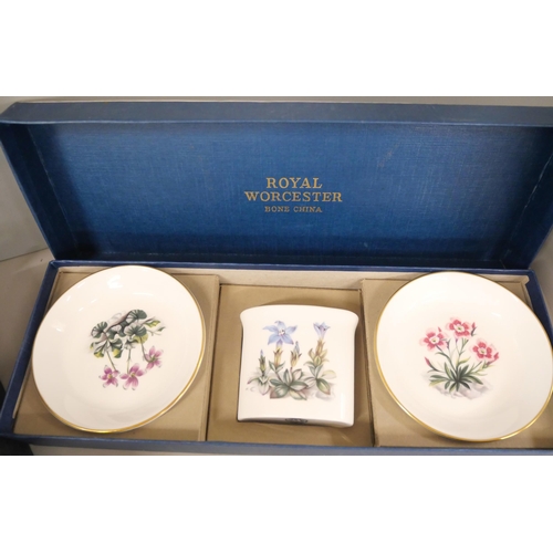 2266 - A collection of Royal Worcester bone china includes a boxed coffee set and a set with two trinket tr... 