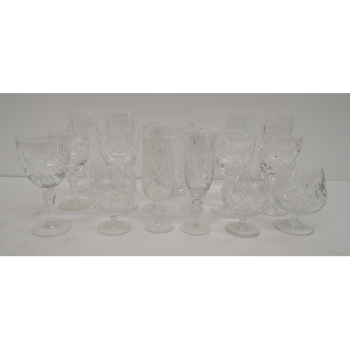 2303 - A collection of cut glass crystal to include water jug, wine glasses, brandy glasses, etc. **PLEASE ... 