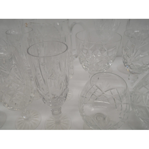 2303 - A collection of cut glass crystal to include water jug, wine glasses, brandy glasses, etc. **PLEASE ... 