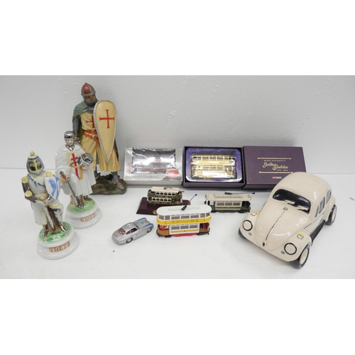 2319 - A mixed lot of porcelain, die cast vehicles and glass includes figures, jugs, a Beetle car, two Napo... 