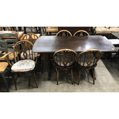 247 - An Ercol Golden Dawn elm and beech refectory table and a set of six fleur di lis chairs