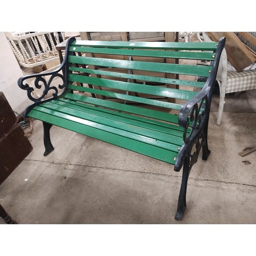 259 - A cast iron and painted wooden garden bench