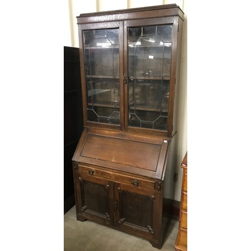 249 - An early 20th Century oak bureau bookcase