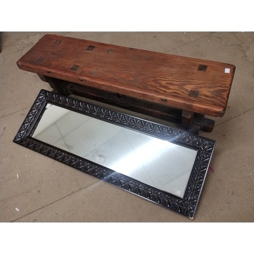 265 - A pine bench and a Victorian carved oak framed mirror