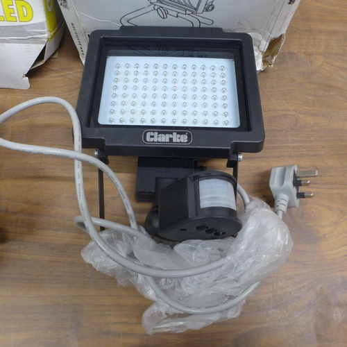 5054 - Two boxed sample portable halogen floodlights  * This lot is subject to VAT