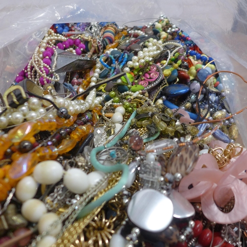 5083 - A bag containing a large quantity of costume jewellery