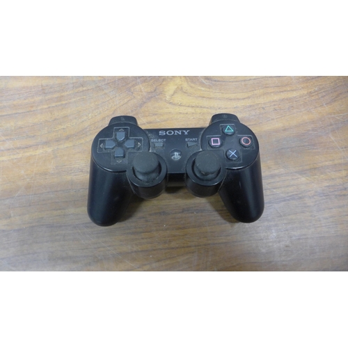 5090C - A quantity of gaming related electronics including a Wii U console with nun-chuck remote attachment,... 