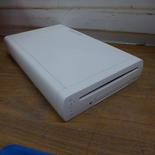 5090C - A quantity of gaming related electronics including a Wii U console with nun-chuck remote attachment,... 