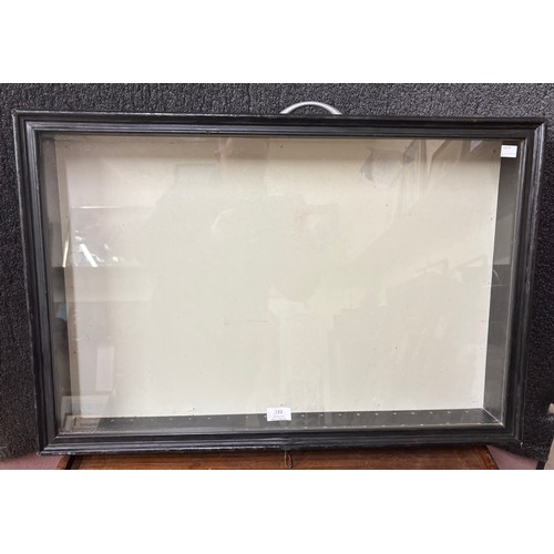 332 - An ebonised table top display case