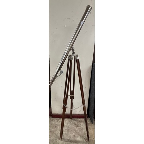 337 - A chrome telescope on an adjustable teak tripod stand