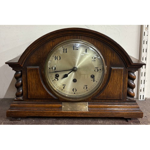 343A - An early 20th Century oak mantel clock